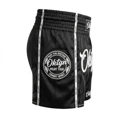 Short Muay Thai OKTAGON noir profil droit medaillon brode